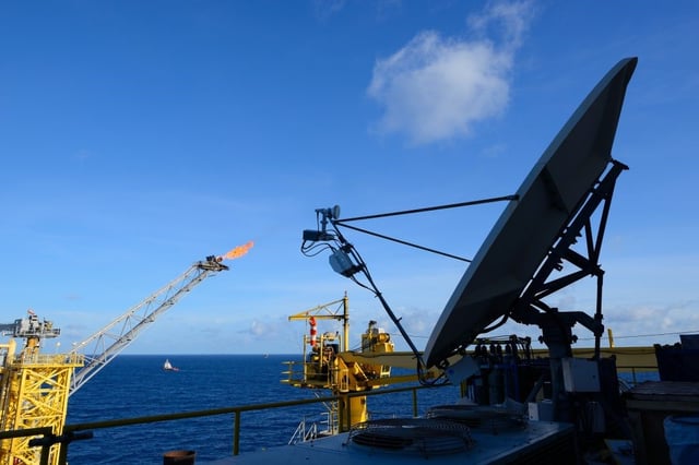 Satellite dish is set on an oil rig