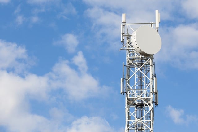 Telecommunications antenna tower for radio television and telephony with beautiful blue sky.